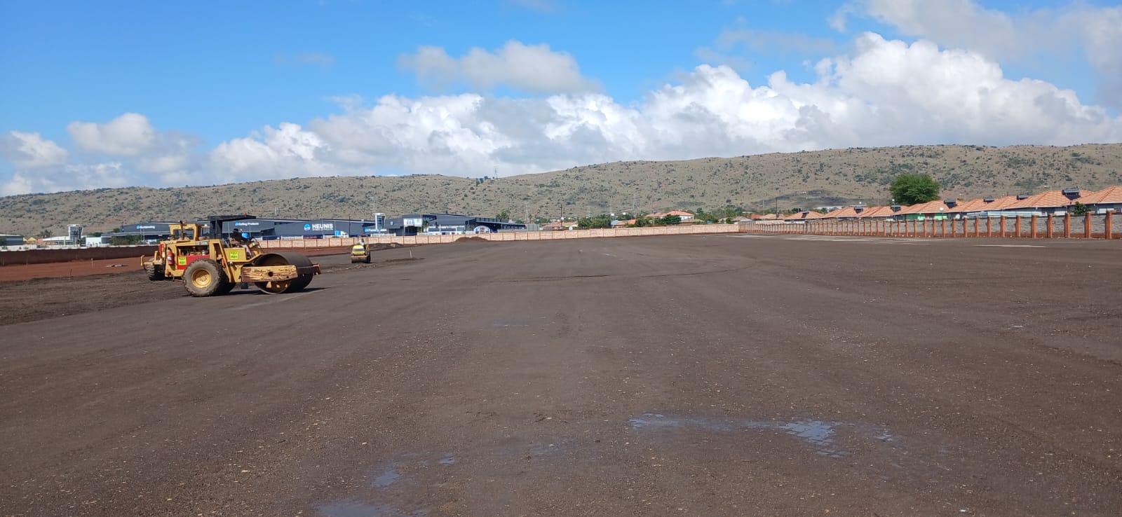 Large-scale earthworks and site leveling with heavy machinery